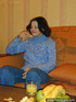 Tipsy young brown girl dressed in blue strips down on the couch to show