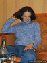 Tipsy young brown girl dressed in blue strips down on the couch to show