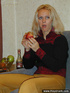 Tipsy blond takes off her pullover trousers and boots and shows off her