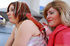 Horny mom in red shows a big dildo to her pretty little teen daughter