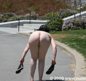 Sexy nudist strips off her clothes right on the public  city streets to