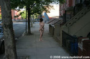 Smiling hot chicks happy to walk outdoors in the city showing their natural nude self