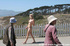 Blonde, pink hair and dark hair babes showing their nude booty in public