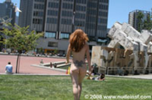 Stunning red head proudly shows her nude body in public square - Picture 6