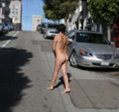 Naughty chick publicly showing off her sexy boobs and booty nude