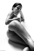 Brunette babe with a braid posing naked fro black-and-white pics