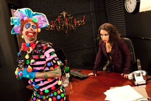 Horny ebony has fun with clown sucking a - Picture 1