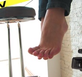 Sexy alluring seductress swings her wide soles