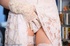 Lovely blonde babe in bride's dress and gloves fingering her twat