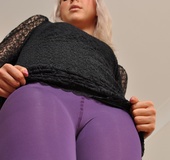 Sexy blondie in purple pantyhose undresses to present her hot body