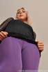Sexy blondie in purple pantyhose undresses to present her hot body