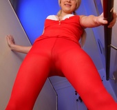 Pigtailed blonde teen in red pantyhose undresses to expose her fresh body