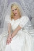 Blonde bride in a dress and stockings toying her cunt before her wedding