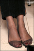 Captivating chick enticing with her wide feet and red toenails in black