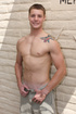 Big muscled man giving two cocks a blowjob while being blowed himself