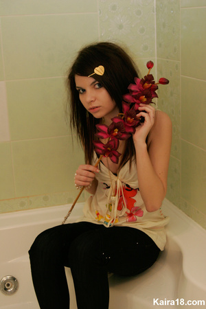 Flower loving sweet young blode girl taking different nice teasy shot with flower - Picture 7