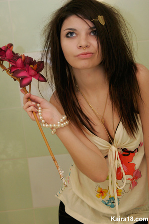 Flower loving sweet young blode girl taking different nice teasy shot with flower - Picture 11
