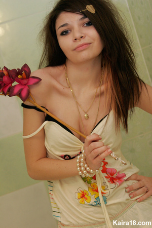 Flower loving sweet young blode girl taking different nice teasy shot with flower - Picture 13