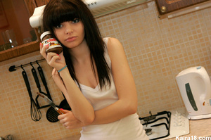 Making erotic fun with Nutella when sizzling teen discovers it in kitchen - Picture 1