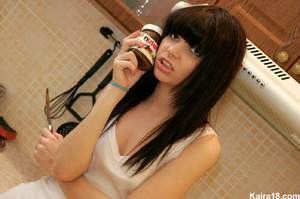 Making erotic fun with Nutella when sizzling teen discovers it in kitchen - Picture 2