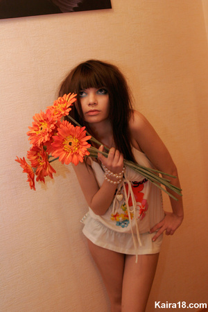 Beautiful pretty young teen girl soft erotic teases with flower in hands - Picture 10