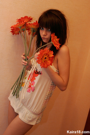Beautiful pretty young teen girl soft erotic teases with flower in hands - Picture 11