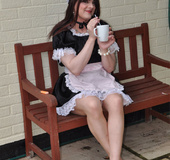 Male crossdresser dressed like innocent sweet girl maid in uniform