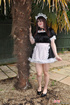 Male crossdresser dressed like innocent sweet girl maid in uniform