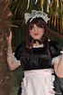 Male crossdresser dressed like innocent sweet girl maid in uniform