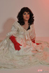 Sexy male chick with red gloves drops white gown to reveal sexiness