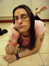 Bored male chick in glasses shows smooth ass and takes sexy photos