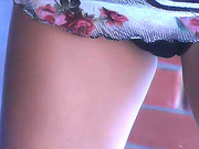 A stunning bitch in her printed miniskirt seductively showing all her skin