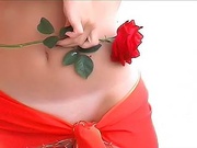 A lovely rose matching a sexy smooth slut's body slightly covered in red bandana