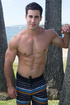 Muscular brunette guy exposing his gorgeous body and long dong