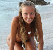 Hot teen Clover posing nude in the ocean wave
