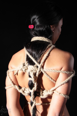 Long haired brunette gets painfully tied - Picture 11