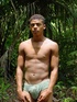 Frolicking in the water is a naked dark skinned horny latino enjoying