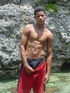 A robust young bronze latino sunbathing among the rocks and wanking that