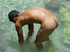 A robust young bronze latino sunbathing among the rocks and wanking that
