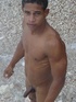 Lusty bronzed latino twink strips for the camera and displays his humongous