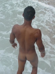 Lusty bronzed latino twink strips for the camera and displays his humongous cock then shows how it can get even large