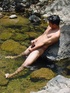 A lewd latino twink takes a dip in the shallow waters of the brook and