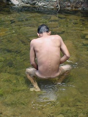 A lewd latino twink takes a dip in the shallow waters of the brook and there jerks himself off in the water until he cums