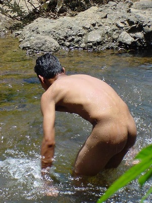 A lewd latino twink takes a dip in the shallow waters of the brook and there jerks himself off in the water until he cums - Picture 14