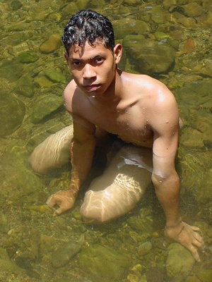 A lewd latino twink takes a dip in the shallow waters of the brook and there jerks himself off in the water until he cums - Picture 15