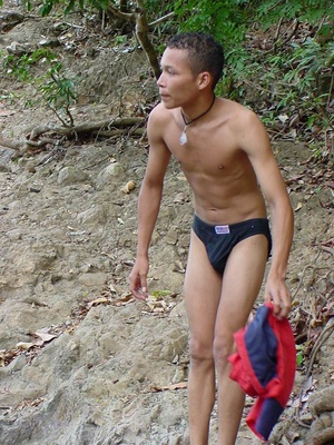 A bronzed lusty latino plays naked in the waters of a brook showing how to manipulate his nice thick cock - Picture 1