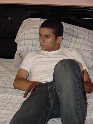 Horny latino twink gets hot lying on a bed while loving his extra large man pole until he cums deliciously - Picture 2