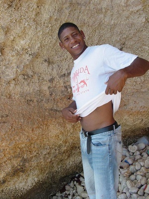 A lascivious young dark skinned latino sunbathing among the rocks and whacking off that impossibly large cock of his until he cums - XXXonXXX - Pic 1
