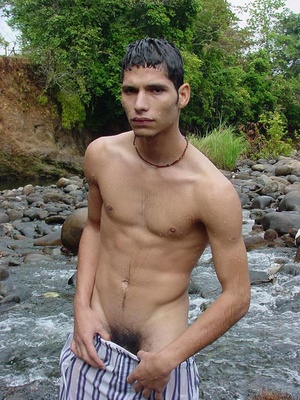 A horny latino twink takes a swim in the shallow waters of the brook and there wanks off in the cool waters until he pops his nut - Picture 2