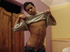 A bronzed lusty latino plays naked in the bed covers showing how to manipulate